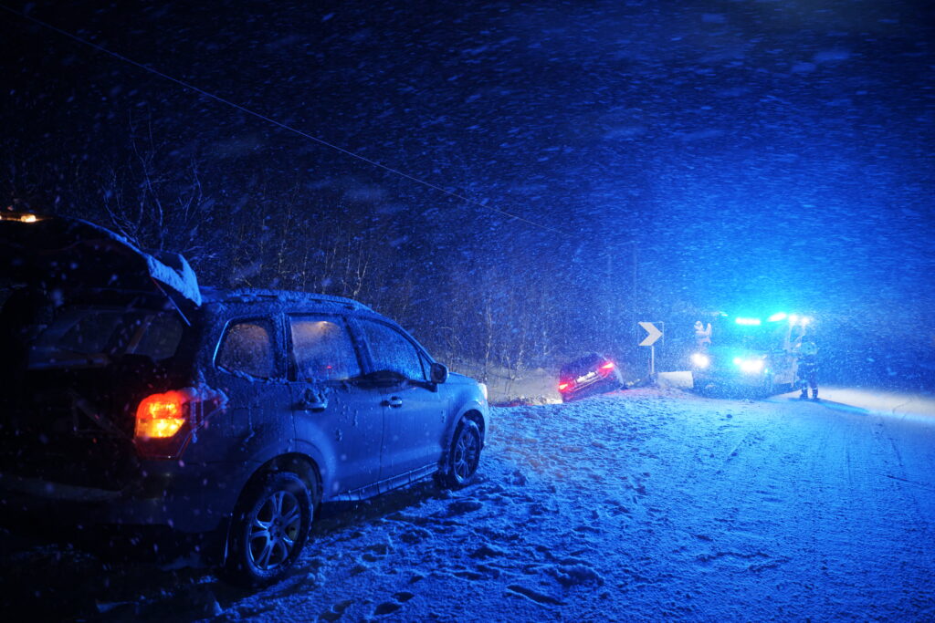 Scene of an accident in snow in the dark